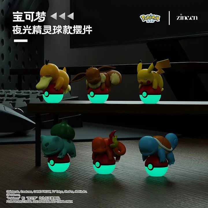 Pokémon Glow-in-the-Dark Poké Ball Display Figures show Psyduck, Eevee, Pikachu, Bulbasaur, Charmander, and Squirtle asleep on glowing Poké Balls.