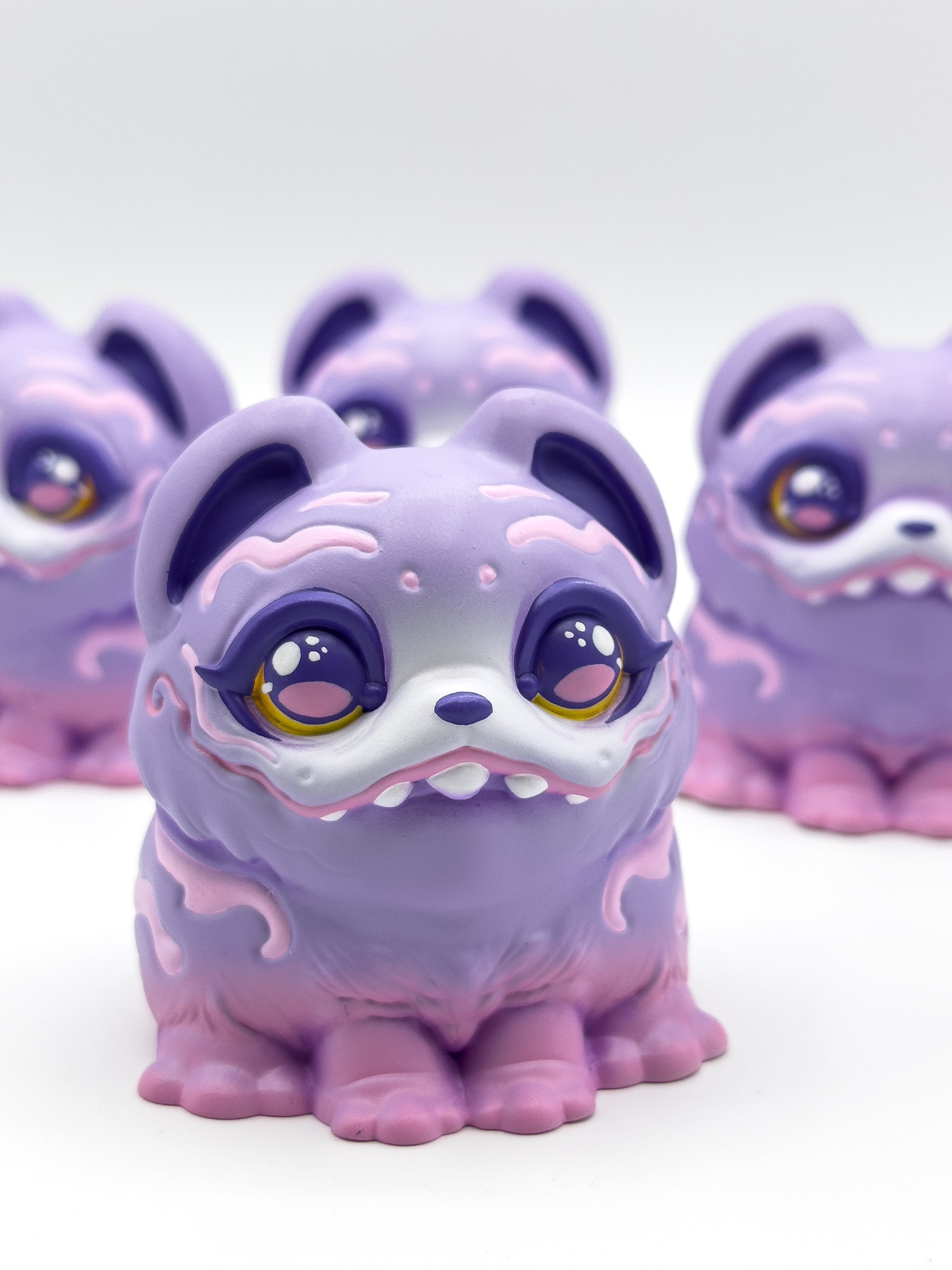 RuRu by Tomodachi Island: three pastel resin art-toy figurines, limited edition, featuring chubby, fantasy-animal designs with glossy eyes and swirl markings.