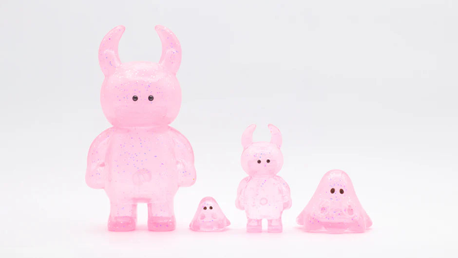 Four MINI BOO CLEAR PINK GLITTER vinyl figures, featuring horned and blob shapes, semi-transparent with glitter, showcasing Strangecat Toys' unique art toy aesthetic.