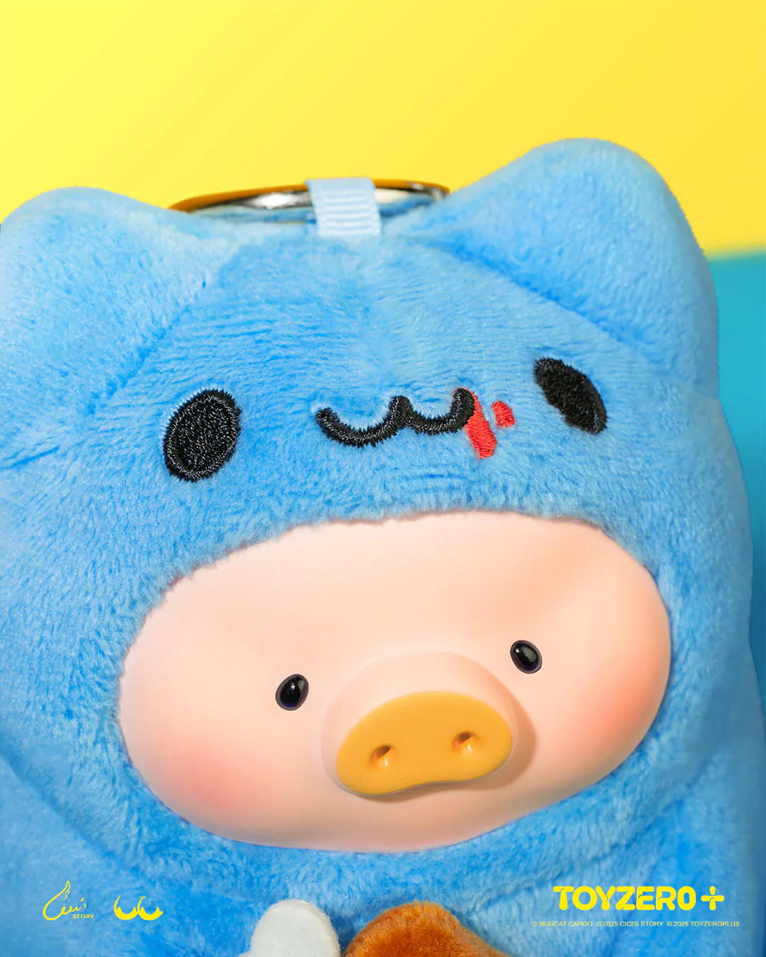LuLu the Piggy x Capoo - Foodie Lu PVC Face Plush Keychain, featuring a piggy in a fuzzy blue hood with cat ears, showcasing a coin slot.