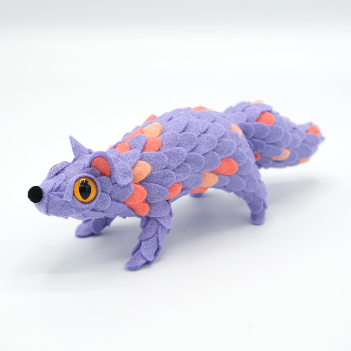Adorable Oracle by Horrible Adorables x Faunwood: A stylized plush creature with felt scales, amber eyes, a rounded snout, and a tapering tail.
