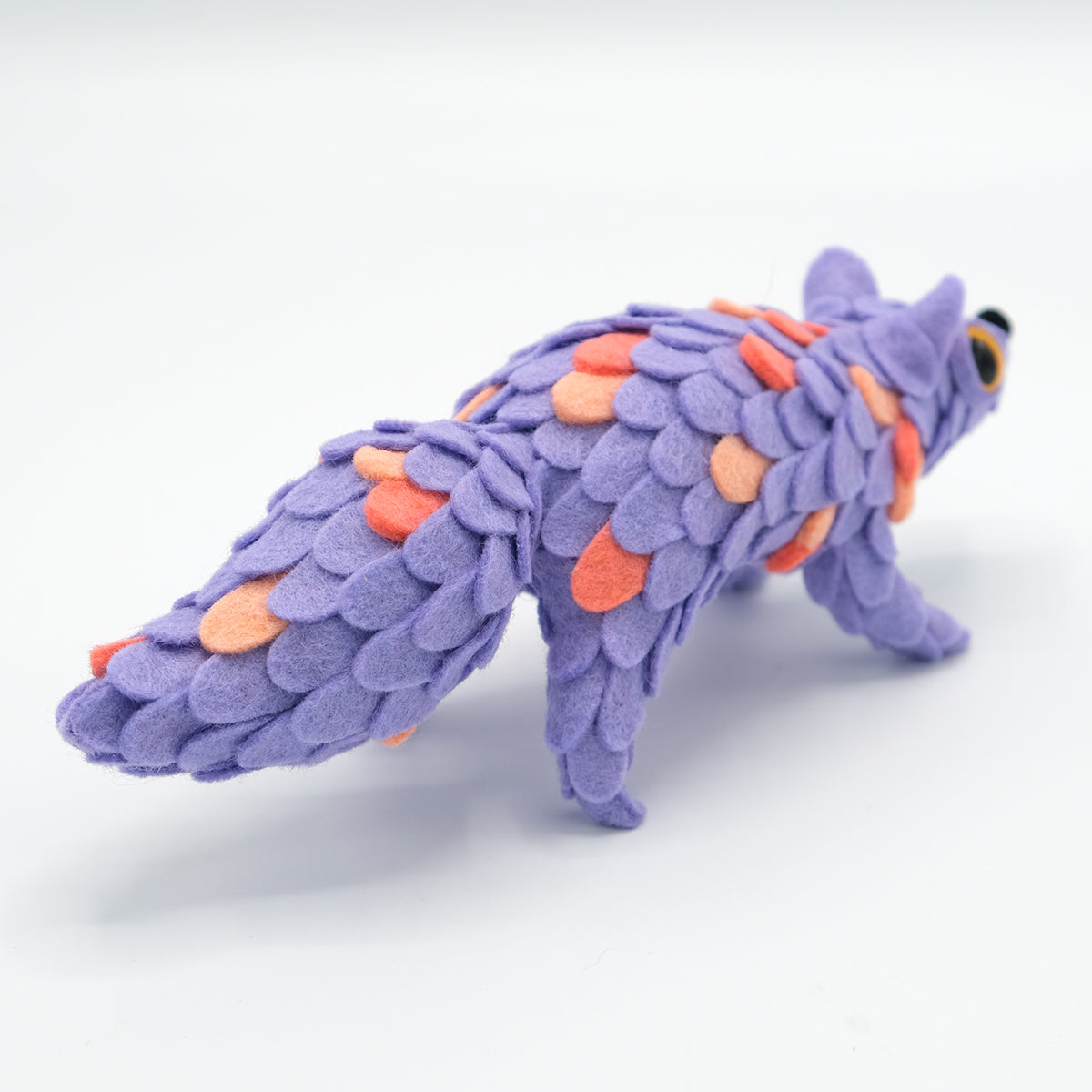 Hand-crafted plush creature, fox-like, with lavender felt scales, part of ORACLE Group Show - Adorable Oracle by Horrible Adorables x Faunwood.