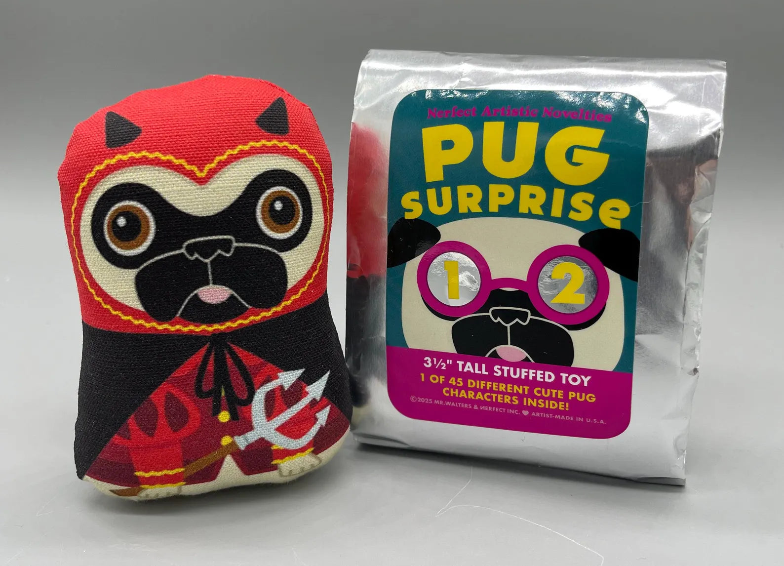 Nerfect Pug Surprise Series 12 plush toy next to its sealed package, offering a blind-bagged collectible experience by Strangecat Toys.