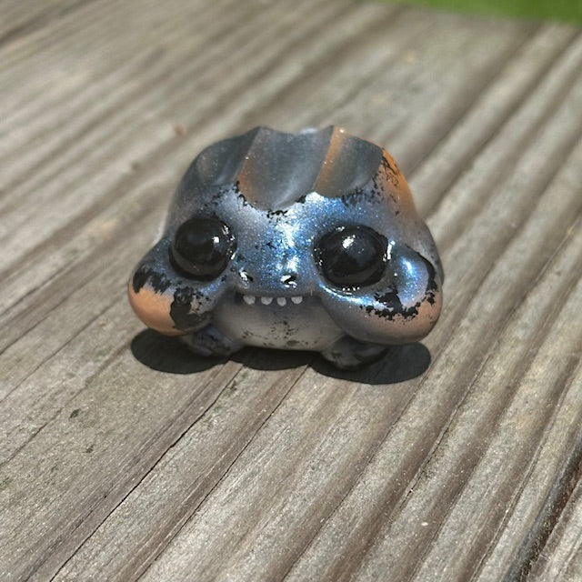 Little Shit Bigger Deal - Beasties Bites by Dear Beasties x Trash Panda: a 2.5 toy frog displayed on a wooden surface.