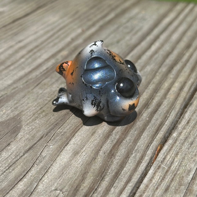 Little Shit Bigger Deal - Beasties Bites by Dear Beasties x Trash Panda: A 2.5 beetle-inspired toy displayed on a wooden surface.