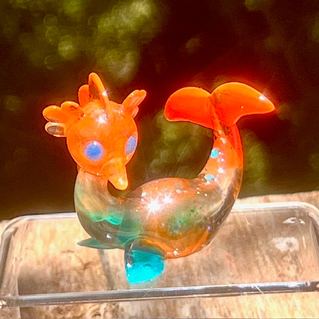 Little Shit Bigger Deal - Beach Day Bessie’s by Leecifer x Horrible Adorables depicts a whimsical orange bird figure in resin, limited to 10 pieces.