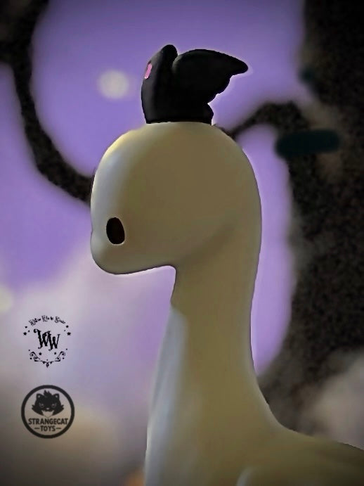 Ghost Dino by Willow Works, a 4 stylized vinyl art-toy, features a ghost-like form with a black headpiece. Limited edition, 75 pieces.