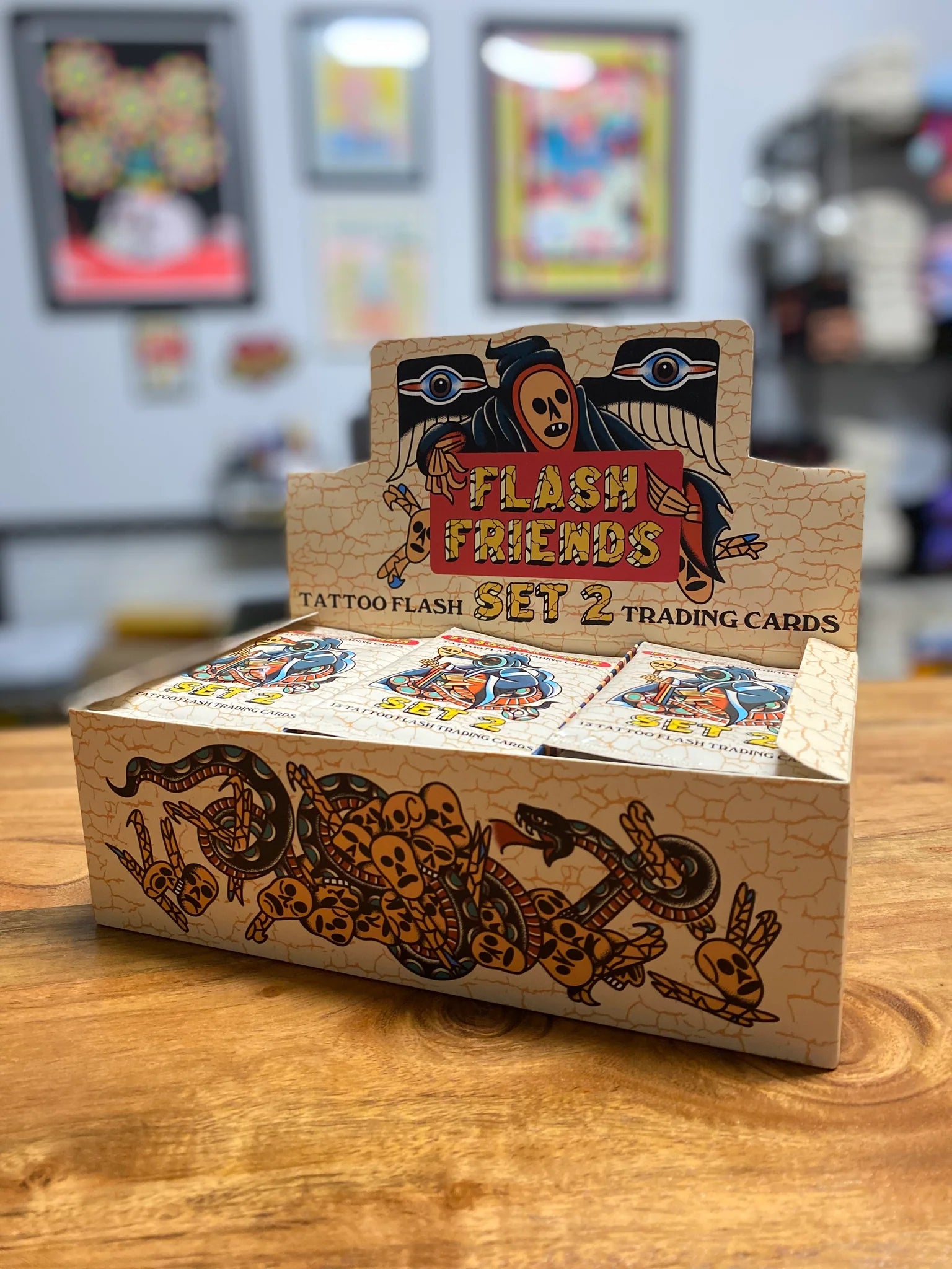 A box of Flash Friends Trading Cards - Set 2 on a table, featuring various card designs and pack options.