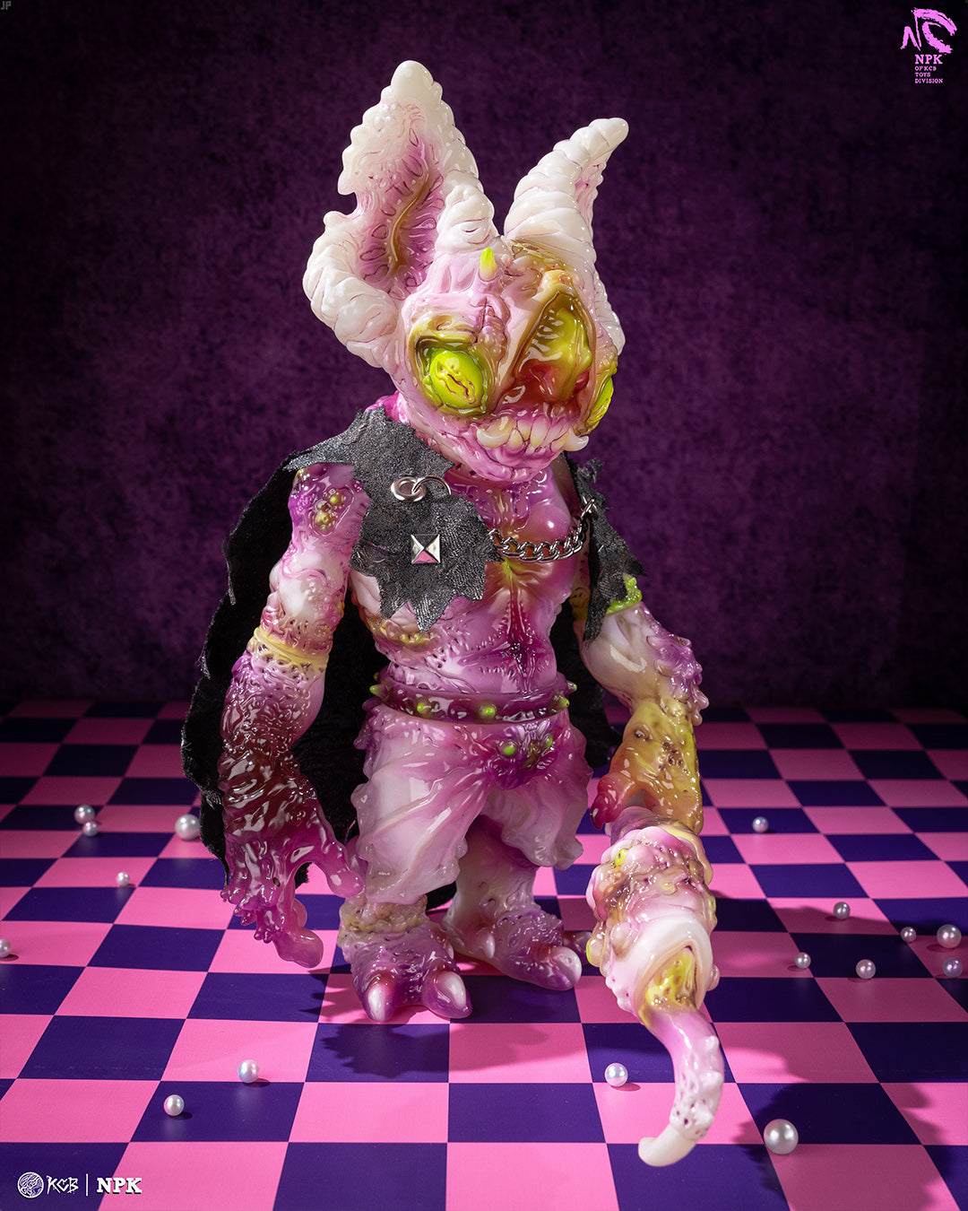 NPK · Poison Veil Ver. & Jack o’ Lantern III by KCB Toy collectible figures, featuring a horned, dripping-texture vinyl figure with a black cape on a checkered surface.