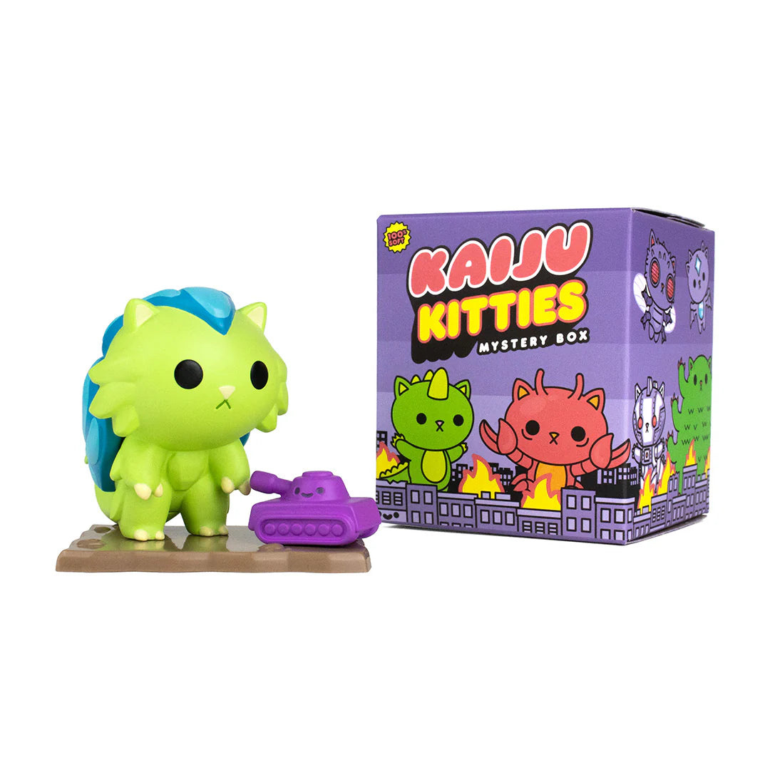 A blind box series by 100% Soft: Kaiju Kitties Mystery Box Series 1. Features adorable trash kitties, a purple toy tank, cartoon cats, a green and blue toy, a cartoon cat, and a dragon.