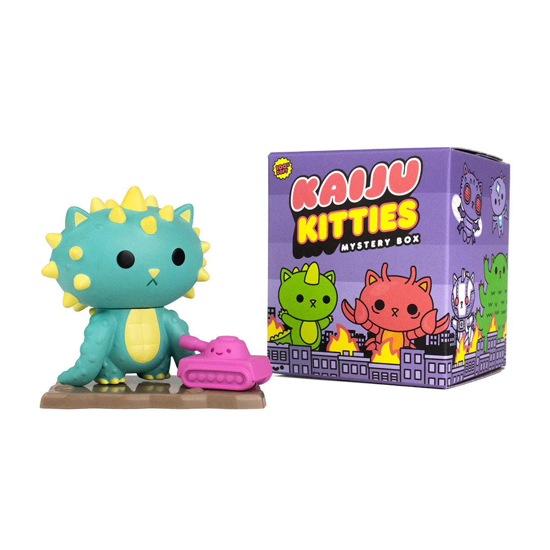 A blind box series: Kaiju Kitties Mystery Box Series 1 by 100% Soft - Preorder. Cuddly monster cats with unique figures, battle platforms, tanks, and fiery building accessories.