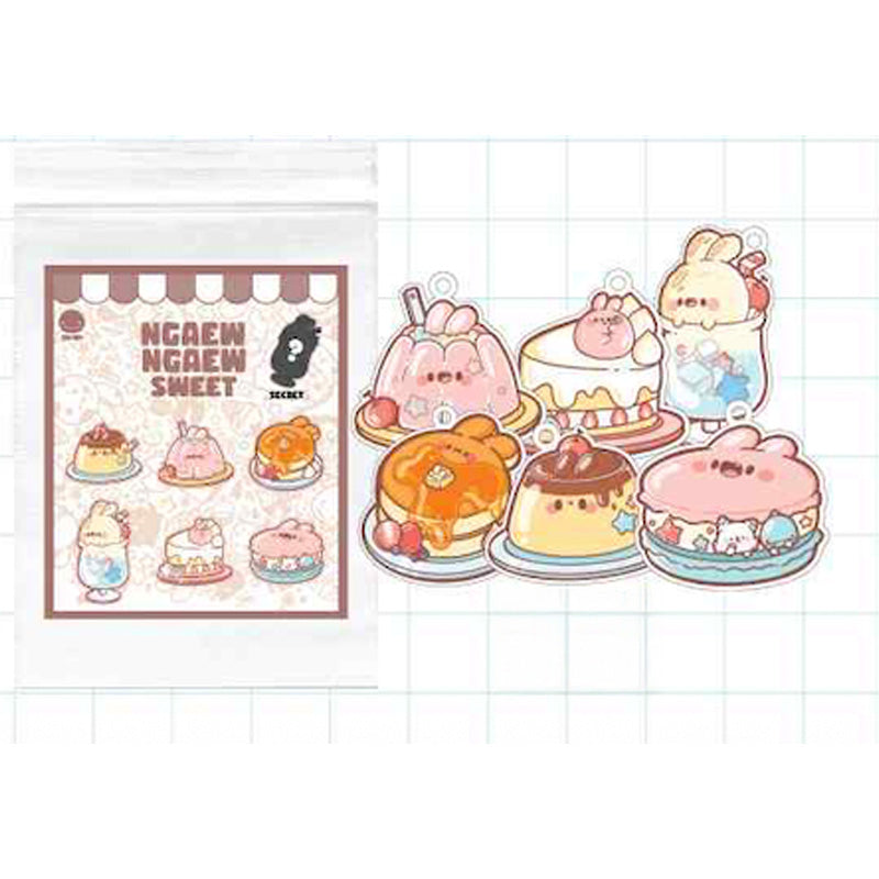 Ngaew Sweet Mystery Acrylic Keychain set with six kawaii animal dessert charms, including a bunny in jelly and bear on pancakes, plus mystery design packaging.