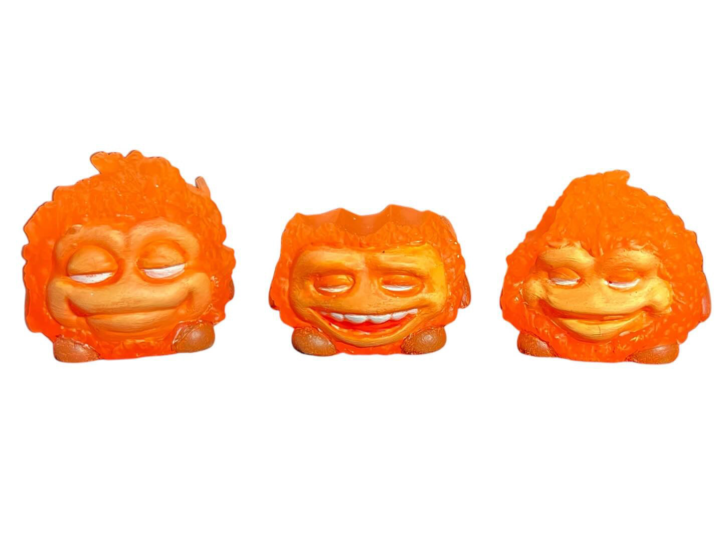 Bite Me - Bud Bites by Fettup: A whimsical, orange character with a smiling face, crafted in mixed media, embodying playful art toy design.