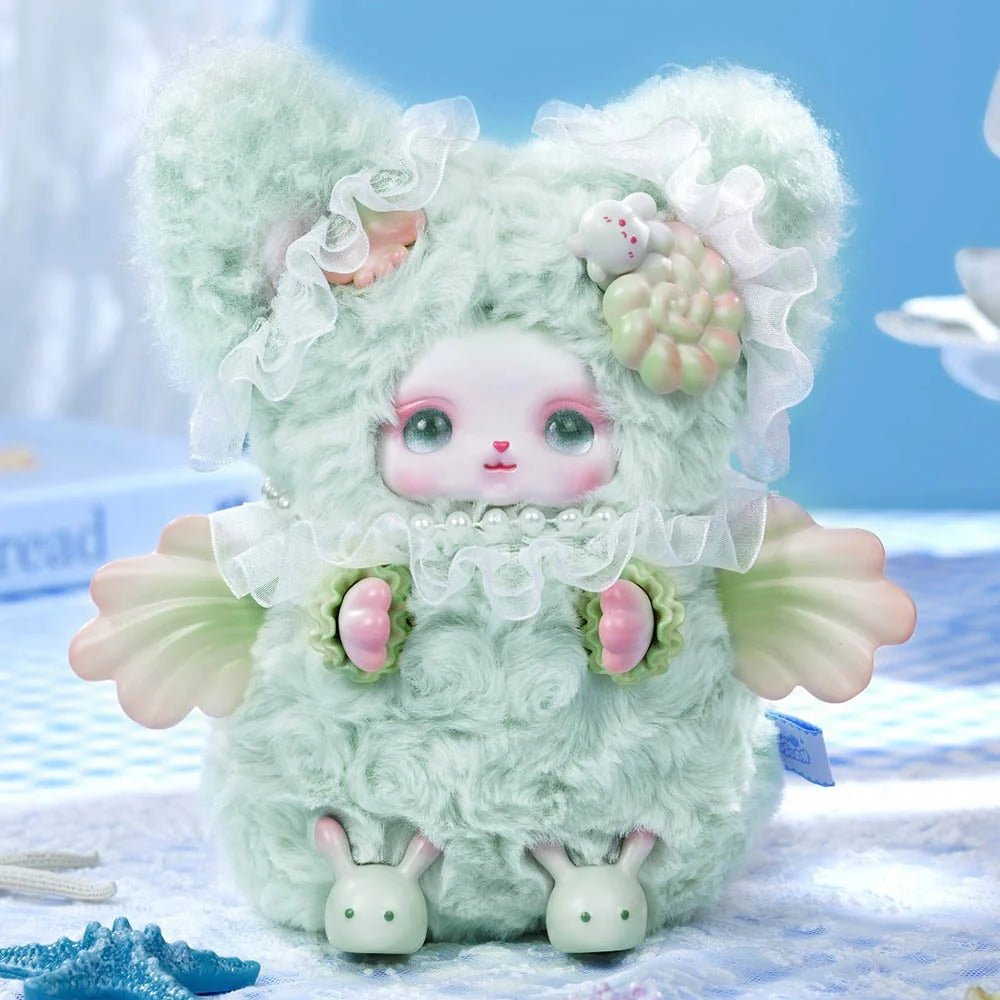 Loloan Ocean Series Plush Blind Box featuring a mint-green creature with lace collar, pearl beads, shell wings, and rabbit feet; whimsical kawaii-style collectible.