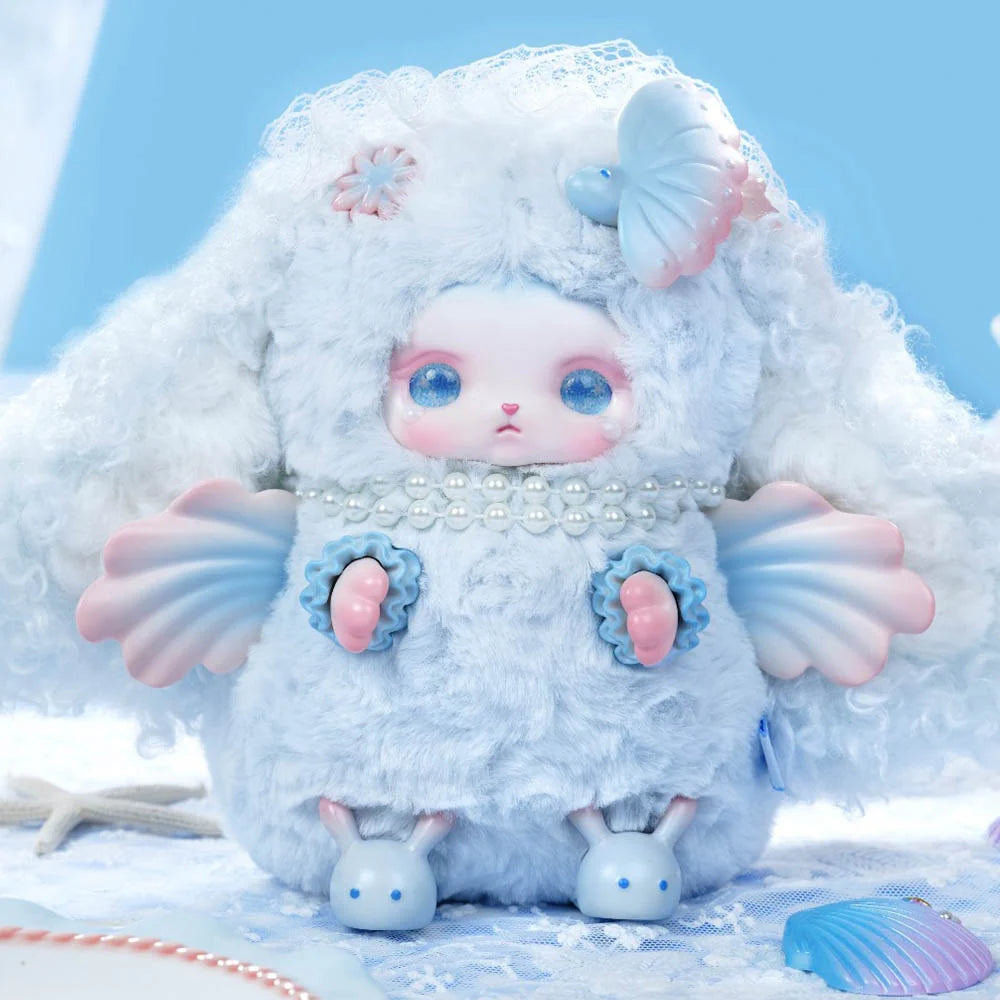 Loloan Ocean Series Plush Blind Box: Fluffy, rabbit-like plush in a sky-blue suit with seashell arms, pearl necklace, and flower accents, embodying a sea bunny theme.