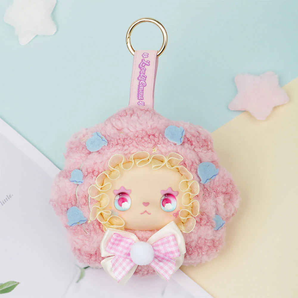 Lovely EMMA Floral Seasons Series Plush Blind Box features a pink lamb keychain with starry eyes, blue flowers, and a gingham bow. Preorder for November 2025.