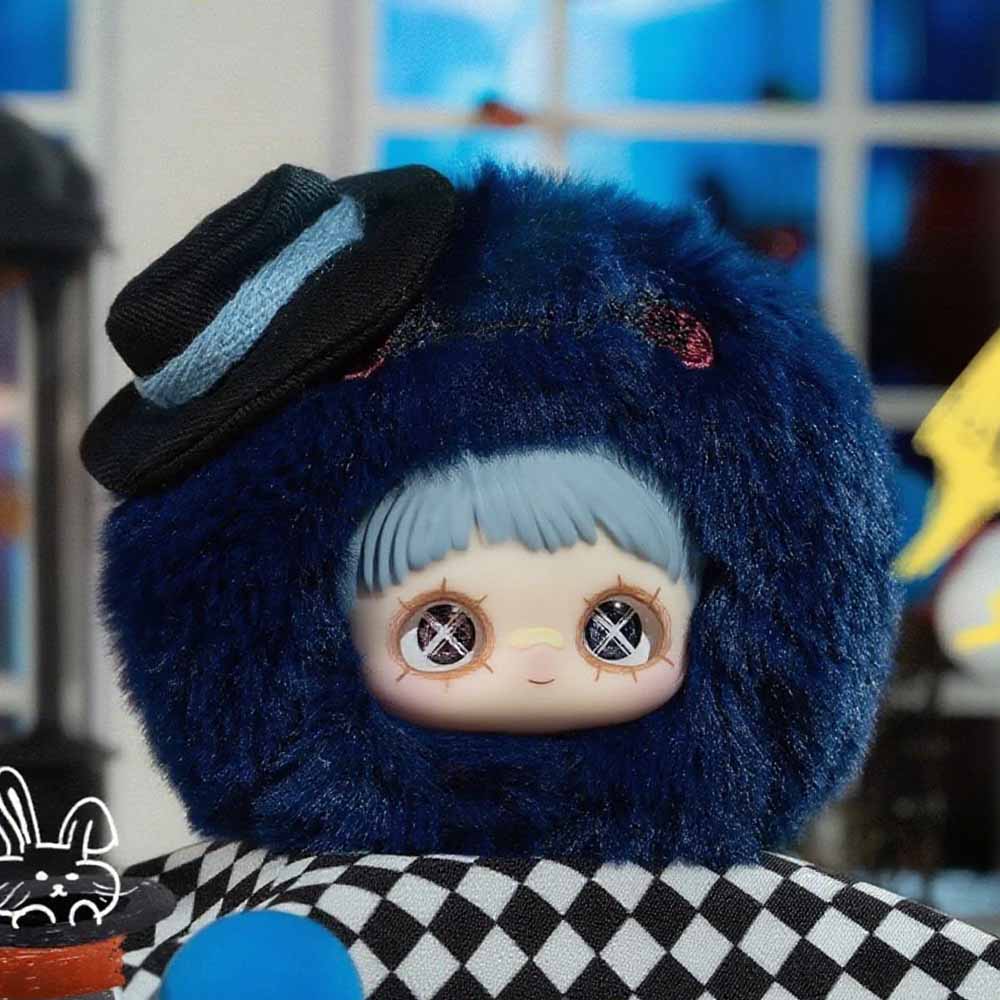 MayMei Crazy Circus Series Plush Keychain: A deep-blue faux fur ball with a face, mini hat, on checkerboard surface, part of a 15-design collectible series.