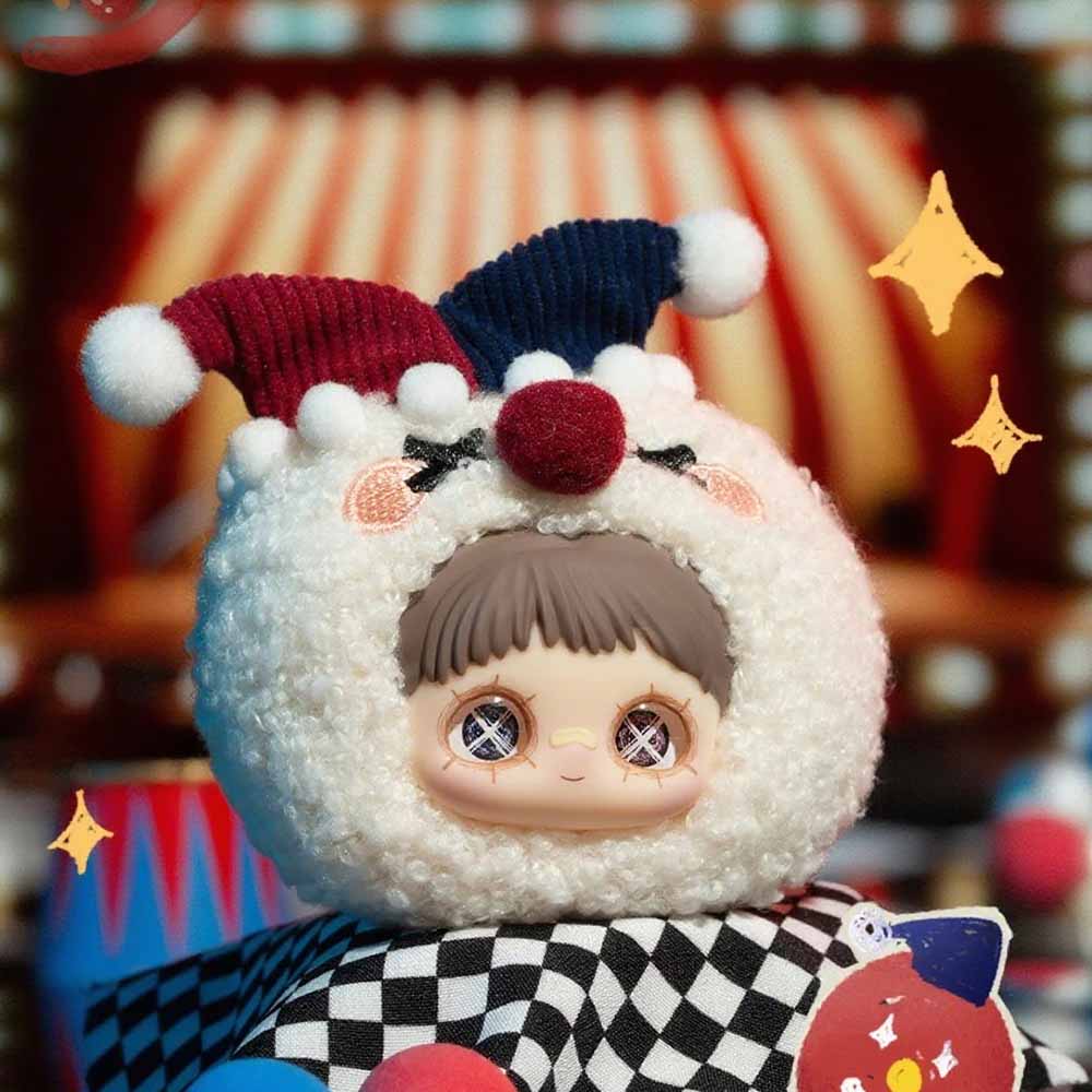 MayMei Crazy Circus Series Plush Keychain Blind Box features a doll in a sheep costume with pom-poms and jester horns, exuding carnival charm.
