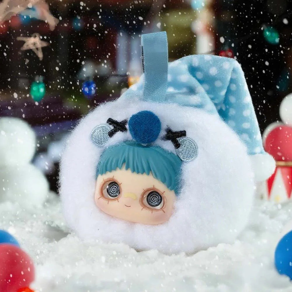 MayMei Crazy Circus Series Plush Keychain Blind Box features a fluffy snow-sprite with felt antlers, spiral eyes, and a blue nightcap in a snowy festive setting.
