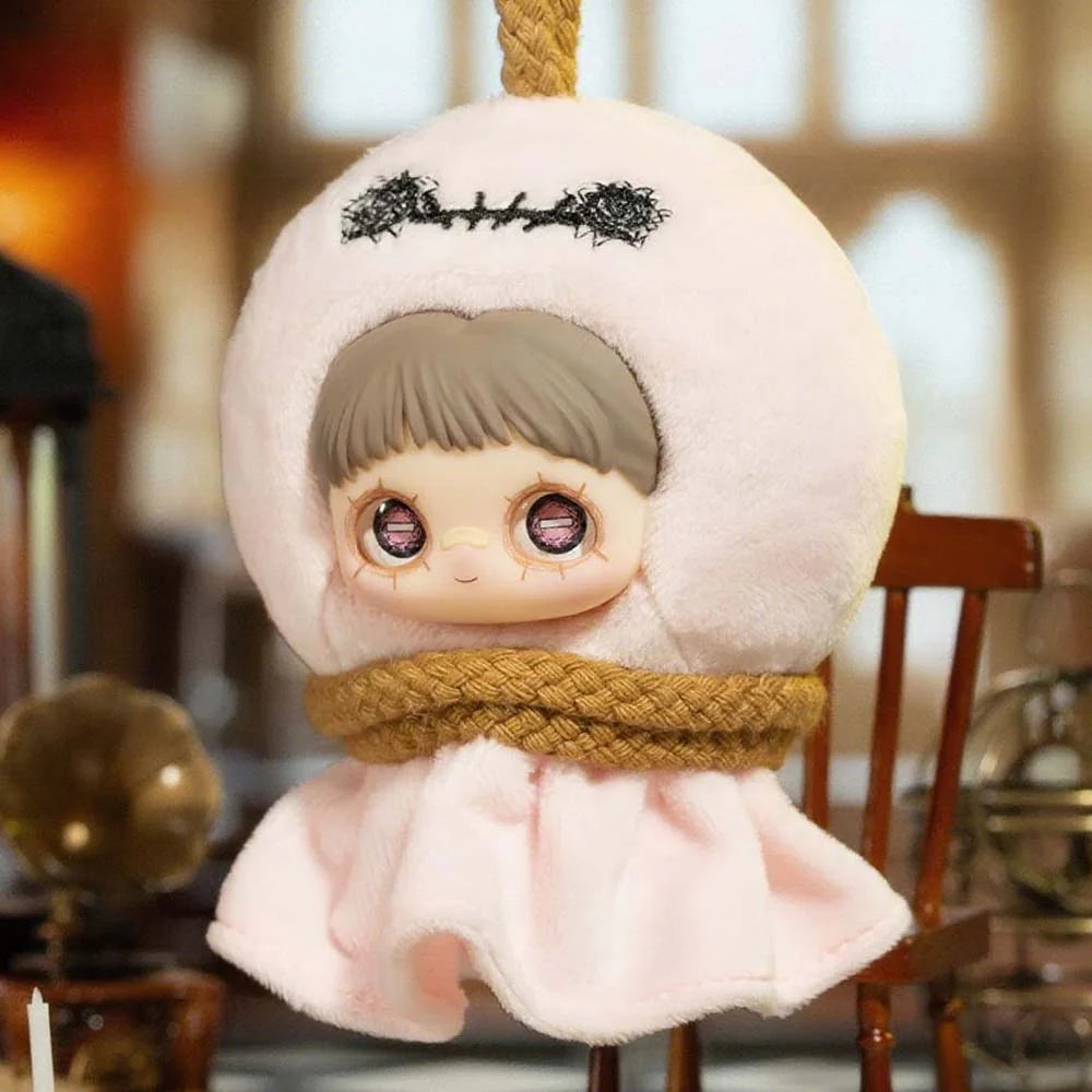 MayMei Crazy Circus Series Plush Keychain features a doll with a large head, glass-like eyes, and a pale-pink hooded cape, suspended by a braided rope.