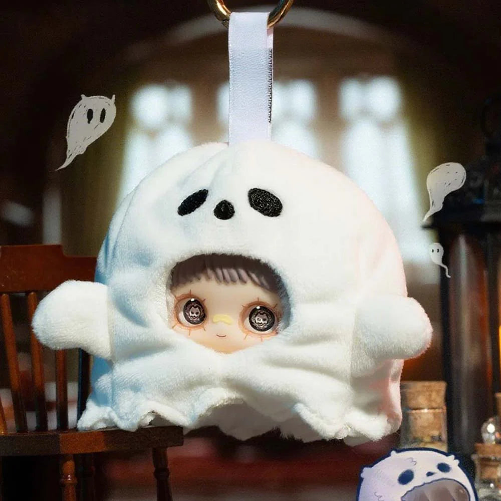 MayMei Crazy Circus Series Plush Keychain Blind Box: A soft ghost-shaped pouch with a doll face window and a hanging loop, surrounded by ghost doodles.
