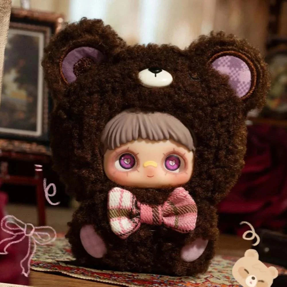 MayMei May I Love You Plush Keychain Blind Box features a doll in a teddy-bear onesie with heart-eye details and a plaid bow tie.