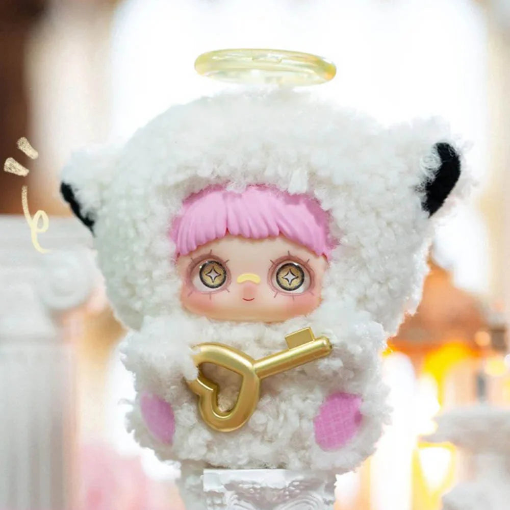 Kawaii-style plush keychain, MayMei May I Love You, in fluffy white costume, holding a heart-shaped gold key, on display. Preorder for Strangecat Toys.