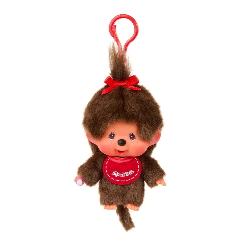 Monchhichi Red Bib Girl Keychain: A 4 plush monkey-like doll with a red bib, tufted hair tied with a red bow, and a plastic hanging hook.
