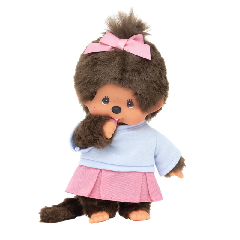 Monchhichi Skirt Girl Plush, a cute monkey-like doll with a pink skirt, blue top, and thumb-sucking feature, perfect for collectors.