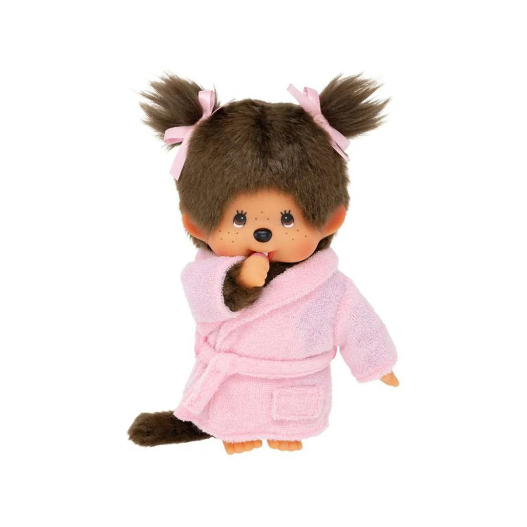 Monchhichi Bathrobe Girl Plush Toy with brown fur, pigtails, and pink bathrobe, thumb in mouth, embodying kawaii charm for collectors at Strangecat Toys.
