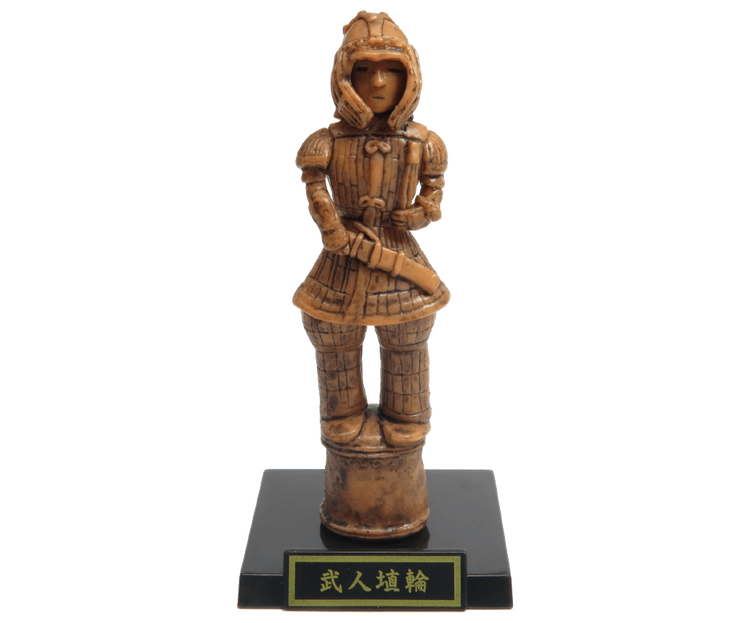 Small figurine of a stylized warrior haniwa in armor on a black base, part of the Haniwa and Clay Figurines + Earthenware and Bronzeware Gacha Series.