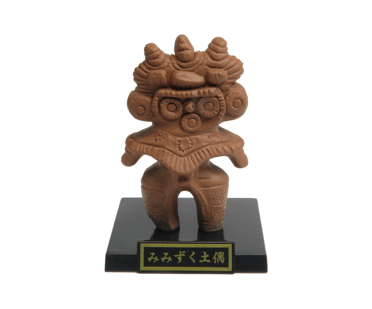 Small brown clay dogū figurine with owl-ear projections on display stand, part of the Haniwa and clay figurines + earthenware and bronzeware Gacha Series.