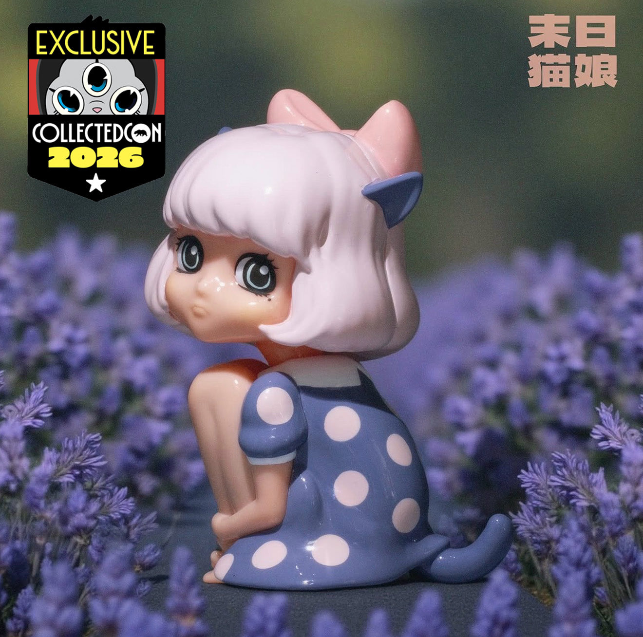 Zombcats Story - Nekomusume Lavender vinyl toy, a cat-girl with pink hair and blue dress, posed in a lavender field for Collected Con 2026 exclusive release.
