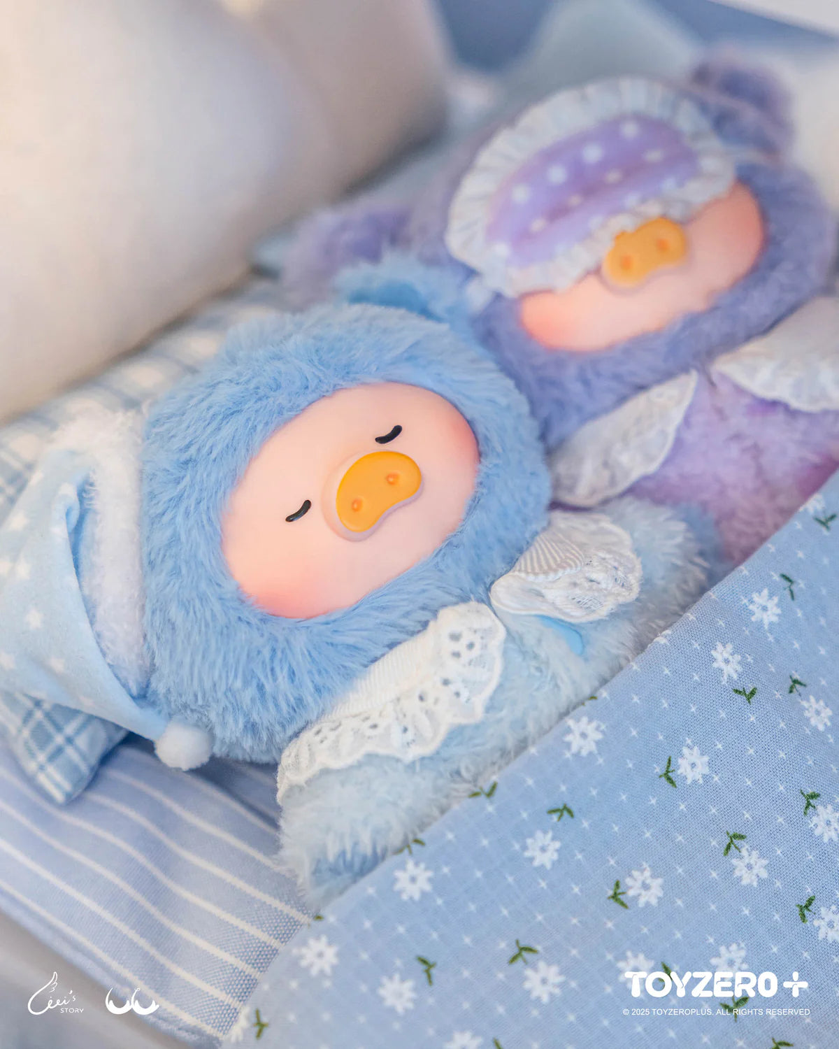Two LuLu the Piggy plush characters tucked into bed, promoting LuLu's Dreaming Wonderland Series PVC Plush Keychain Blindbox by TOYZERO+.