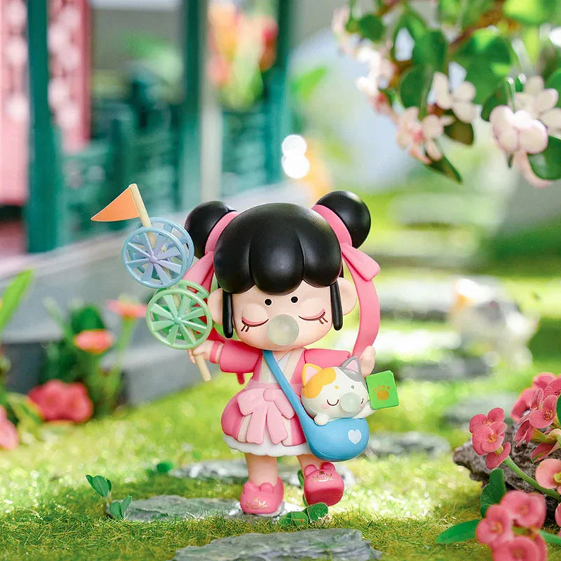 Nanci Series 10 Blooming Girl Blind Box figurine, showcasing a toy girl amidst pink flowers, part of a 13-design collectible set.