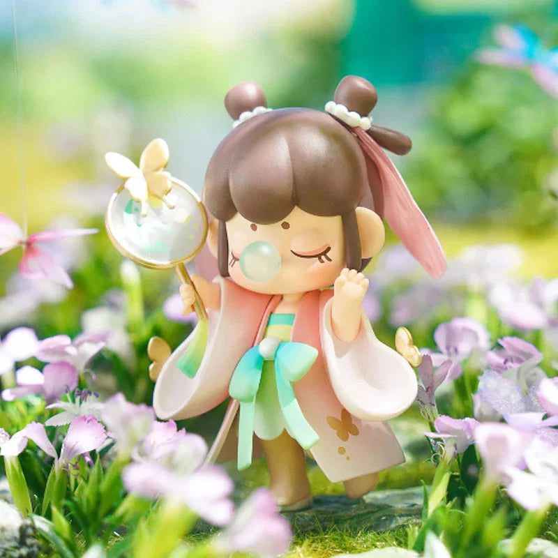 Nanci Series 10 Blooming Girl Blind Box features a cartoon girl figurine with a magnifying glass, part of a collection with 12 designs and 1 secret option.