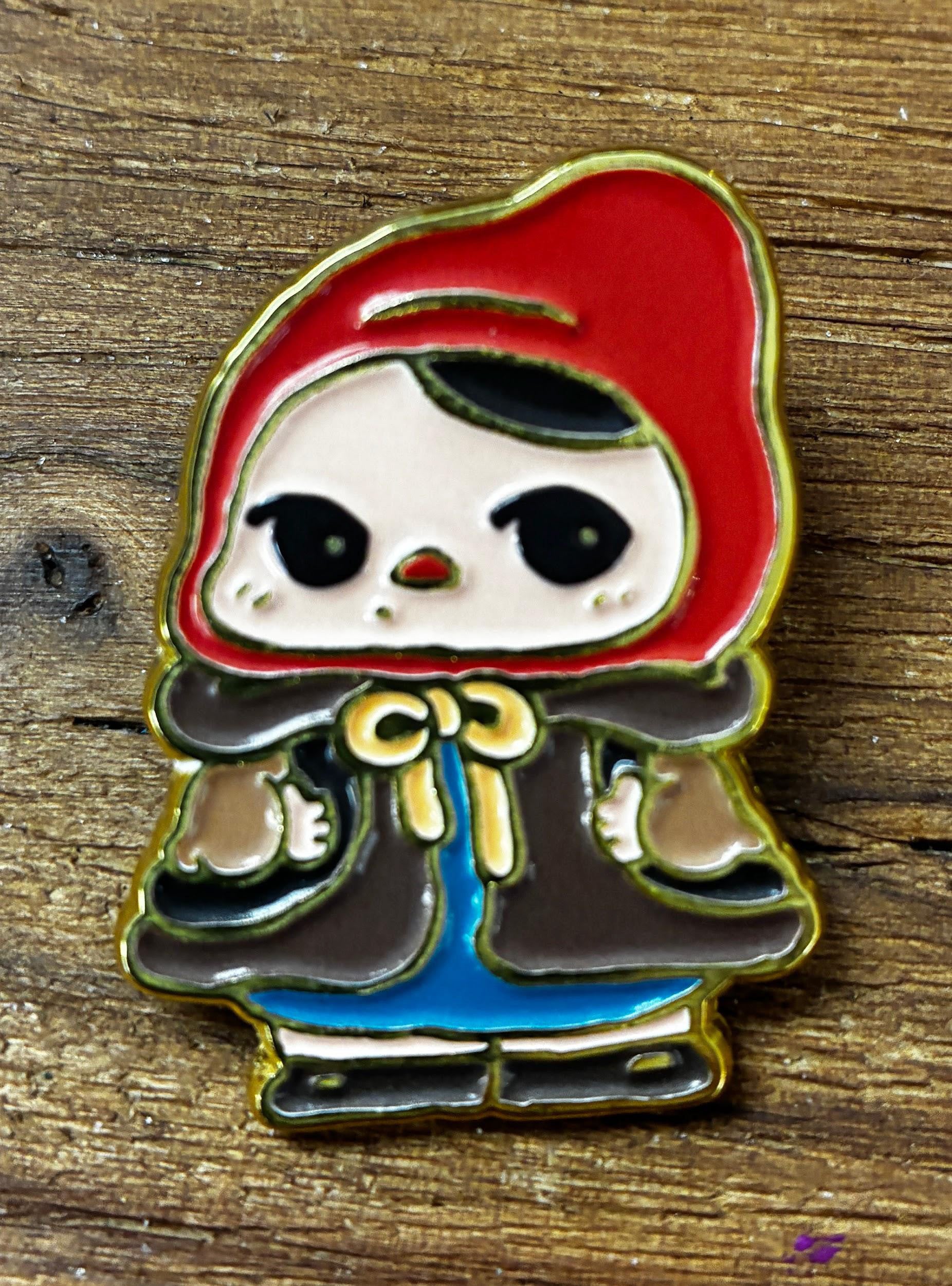 Bloom Pins by Pucky: A cute enamel pin featuring a cartoon-style girl in a red hooded cloak, perfect for collectors of unique art toys.