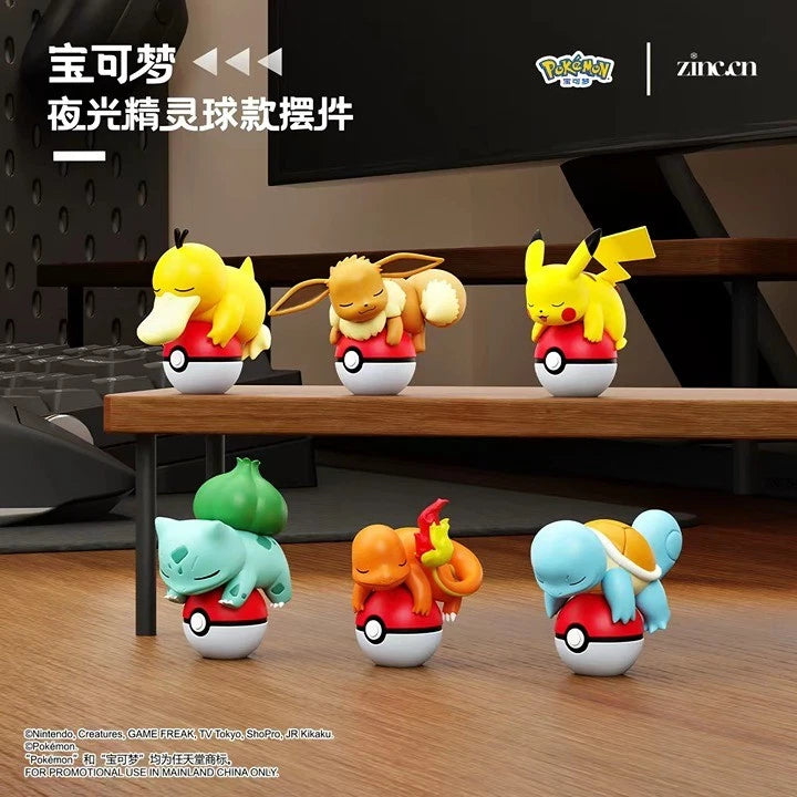 Pokémon Glow-in-the-Dark Poke Ball Display Figures featuring Psyduck, Eevee, Pikachu, Bulbasaur, Charmander, and Squirtle, curled up asleep on Poké Balls.