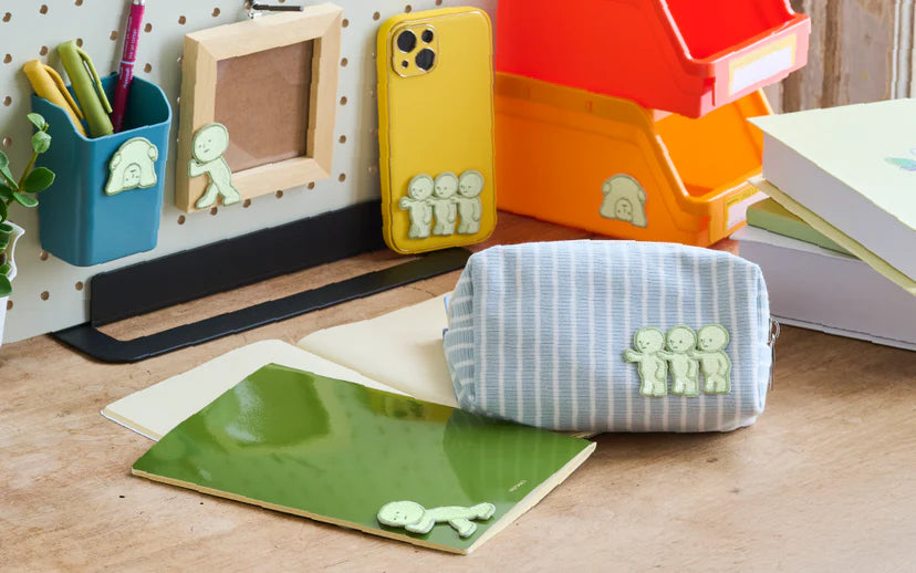 SMISKI Embroidery Sticker Vol. 2 decorates a workspace, adorning a phone case, pencil pouch, and notebook, adding charm to everyday items.