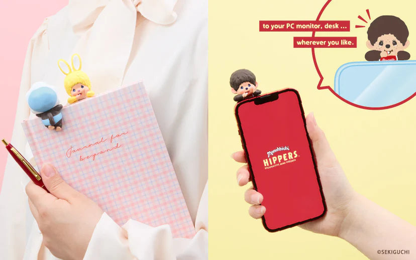 Monchhichi HIPPERS figurines clipped on a journal and smartphone, showcasing versatile decorative use as bookmarks or tech accessories.