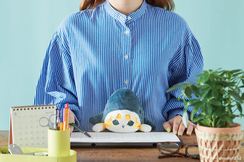 Posture Pal - mofusand: A person sits at a desk with a Shark Meow or Shrimp Meow stuffed animal for posture support.