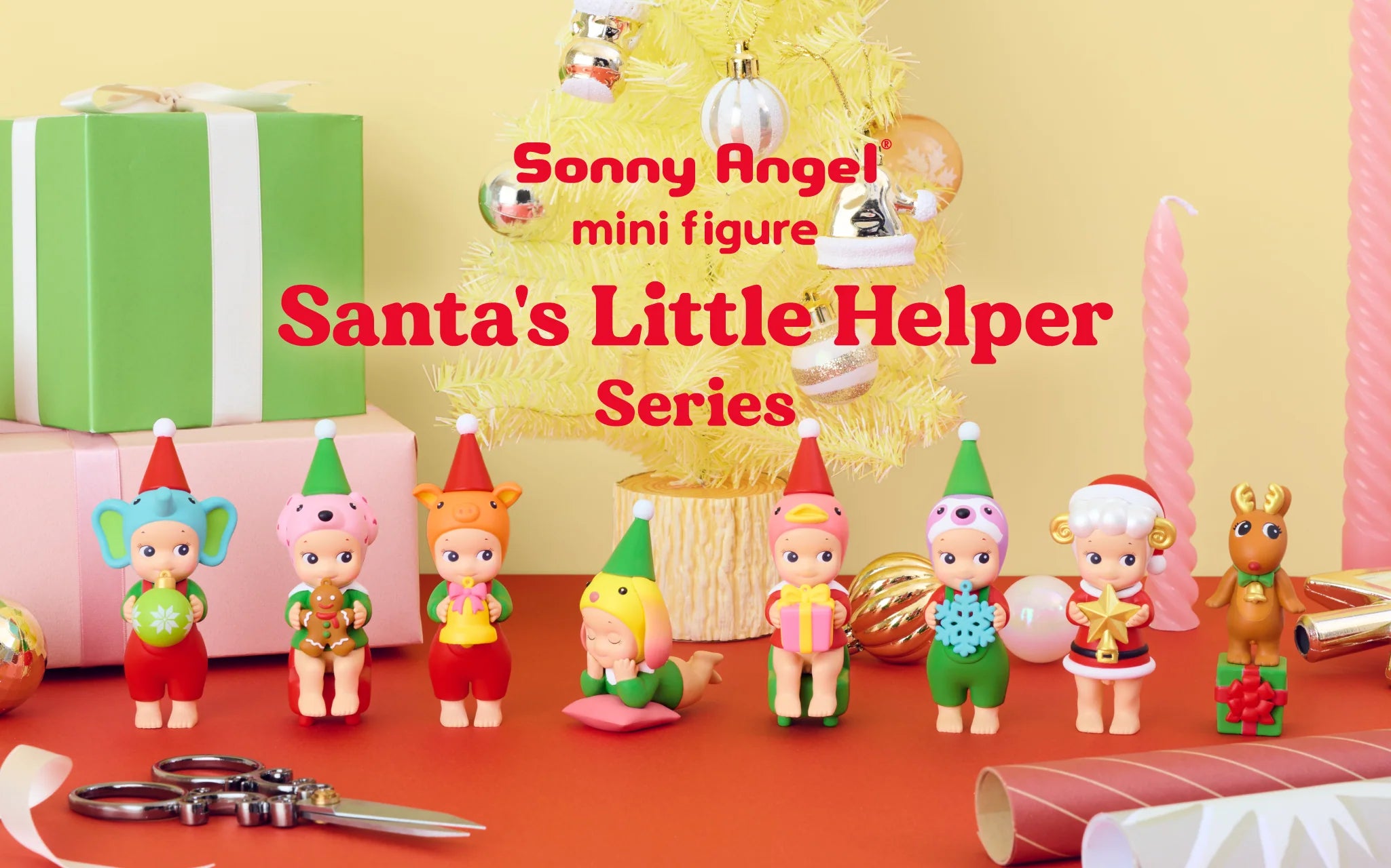 Sonny Angel Santa's Little Helper Series figurines, featuring holiday-themed designs, surrounded by festive props like gifts, candles, and a Christmas tree.