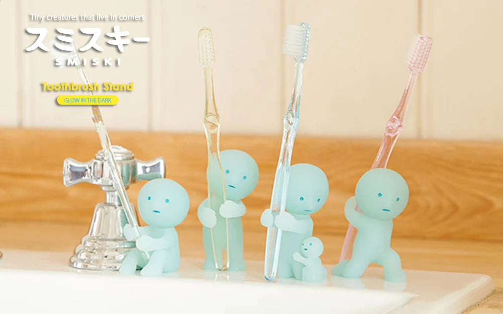 Smiski Toothbrush Stands, whimsical figures for toothbrushes, feature playful poses and glow in the dark, embodying the quirky charm of Strangecat Toys.