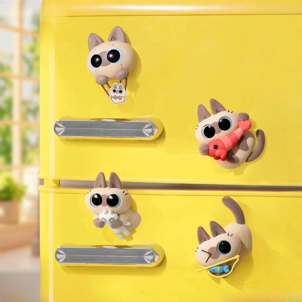 Azukisan Healing Moments Series Blind Box magnets: whimsical cat figures on a yellow fridge, each holding a charm, shrimp, bunny, or fish.