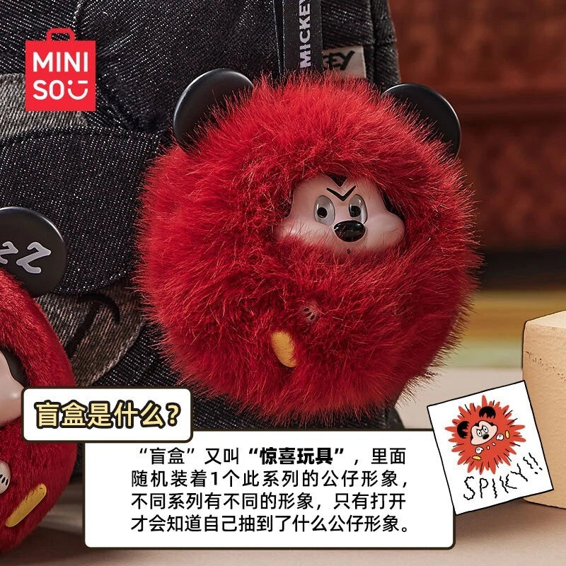 Disney Mickey Joyful Collision Series blind-box features a red pom-pom keychain with a hidden angry Mickey figurine, part of a collectible series.