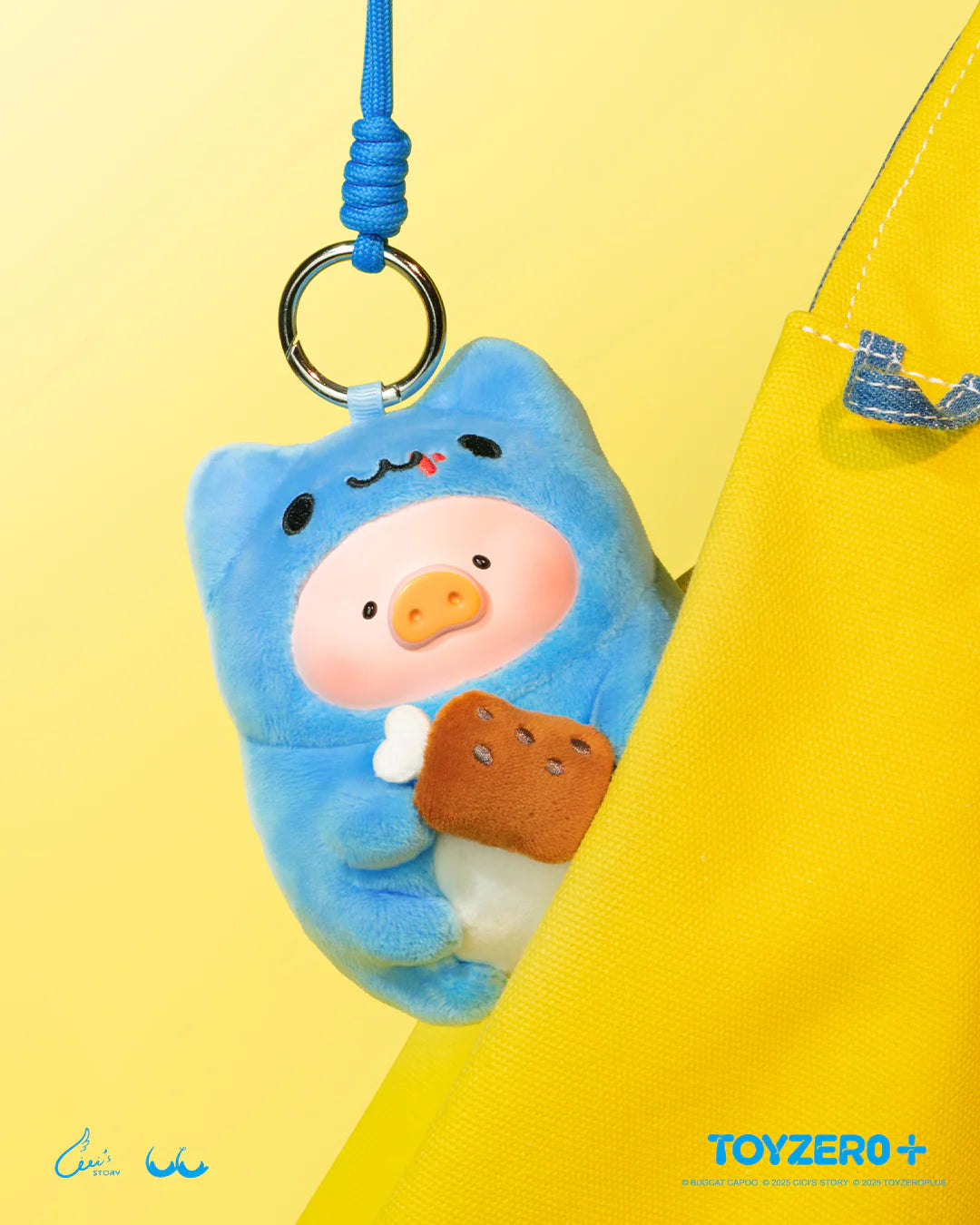 LuLu the Piggy x Capoo - Foodie Lu PVC Face Plush Keychain hanging on a blue cord with a silver ring, featuring LuLu in a cat-ear costume holding a plush drumstick.