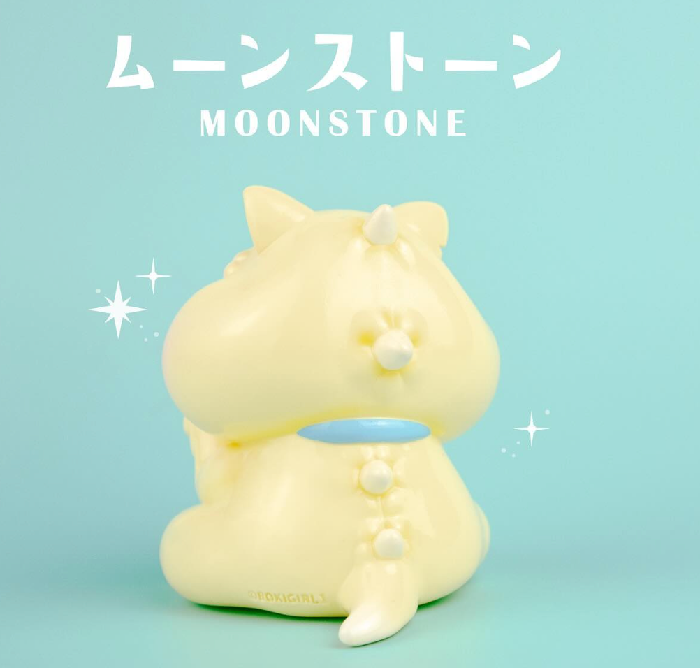 MOONSTONE by Boki x Kenneth Wan: A 9cm pastel-yellow vinyl figure, a cat/unicorn hybrid with a horn, ears, tail, and pearl-like bumps.