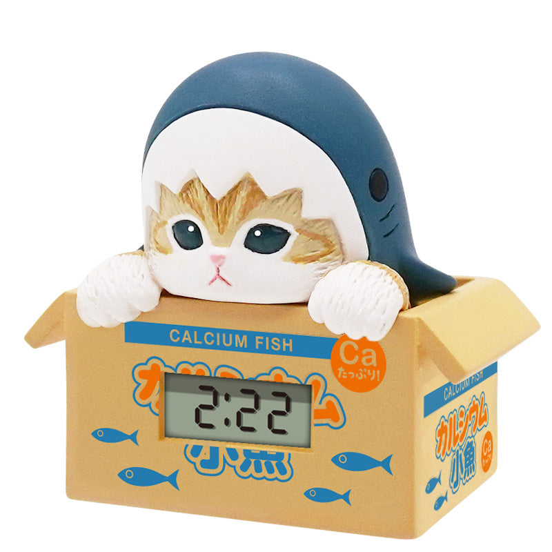 mofusand Sea Creatures Cat Watch Gacha Series features a cat figurine in a shark hood on a Calcium Fish box with an LCD clock display.