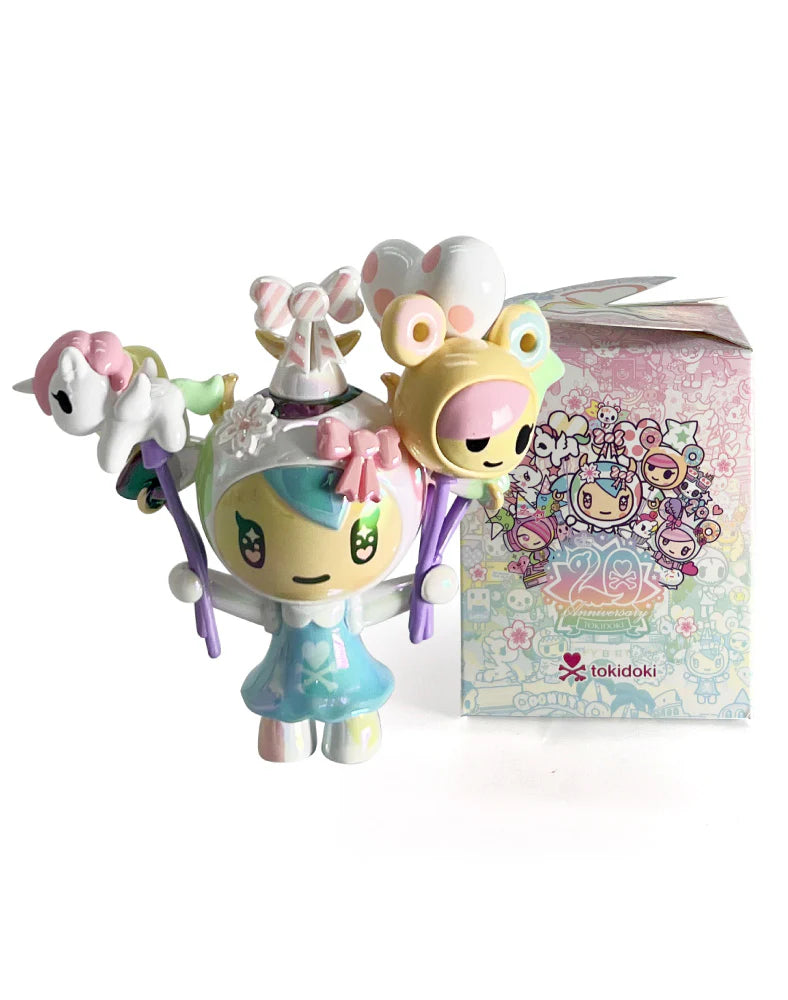 Tokidoki 20th Anniversary Blind Box: Designer vinyl toy with pastel colors and unicorn-horn helmet, posed before its matching collectible box.