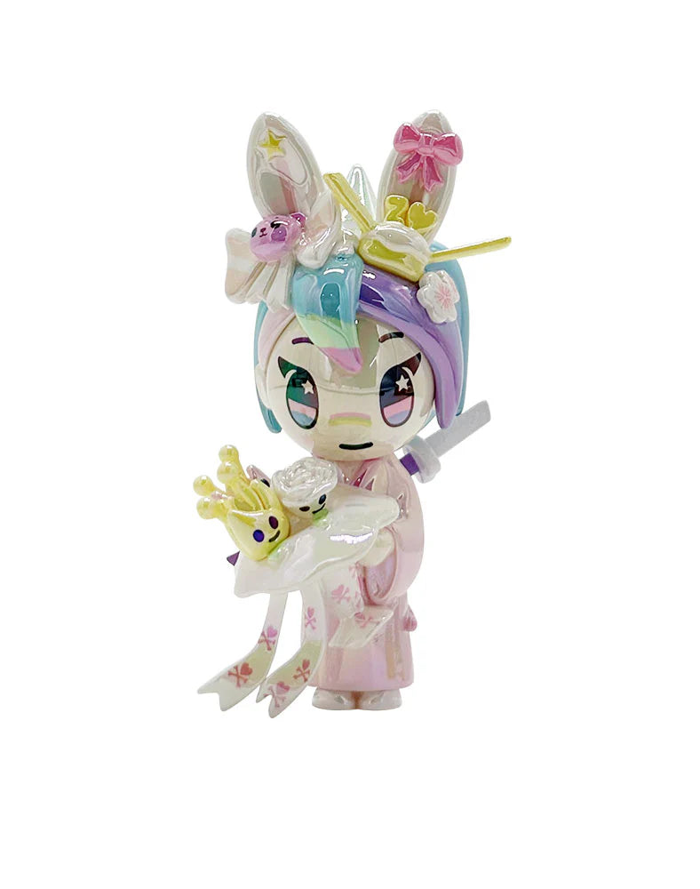 tokidoki 20th Anniversary Blind Box: A pastel art toy with bunny ears, unicorn horn, kimono, holding a tray with mini crowns, celebrating kawaii culture.